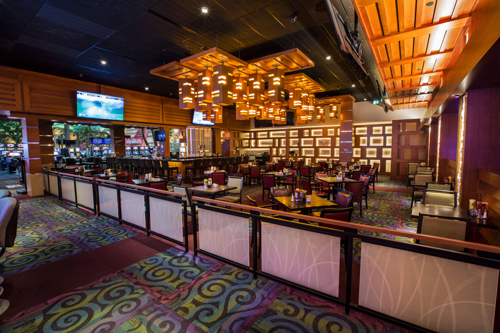 Group of tables and chairs at The Club Regent Casino Toukies Lounge